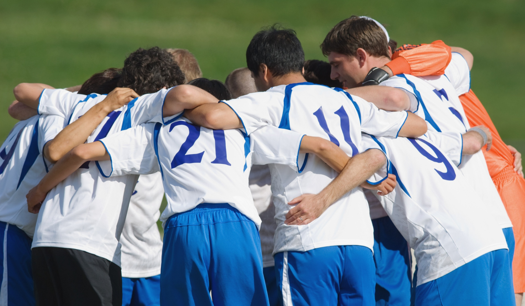 Soccer team huddle